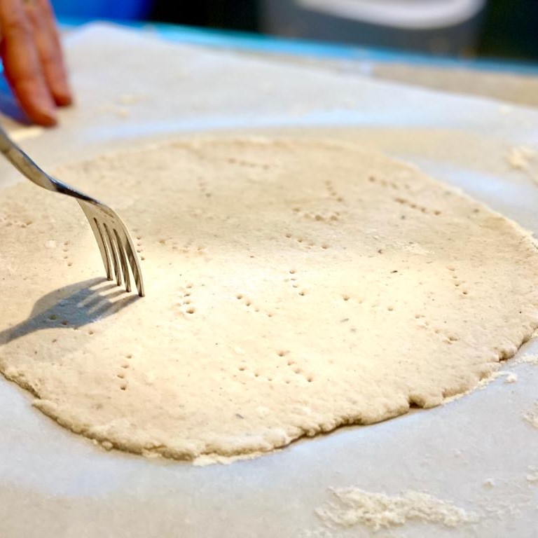 Pizza dough getting pre-baked in the oven